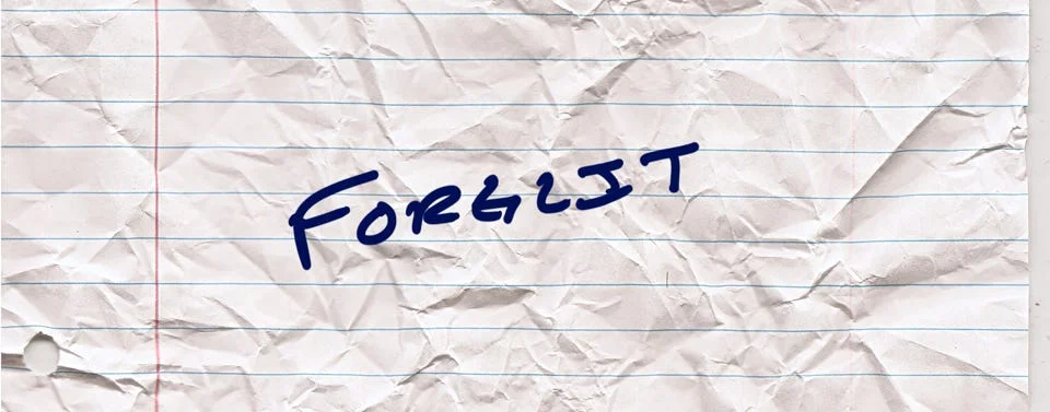 A handwritten note on crumpled lined paper reading FORGLIT in blue marker.